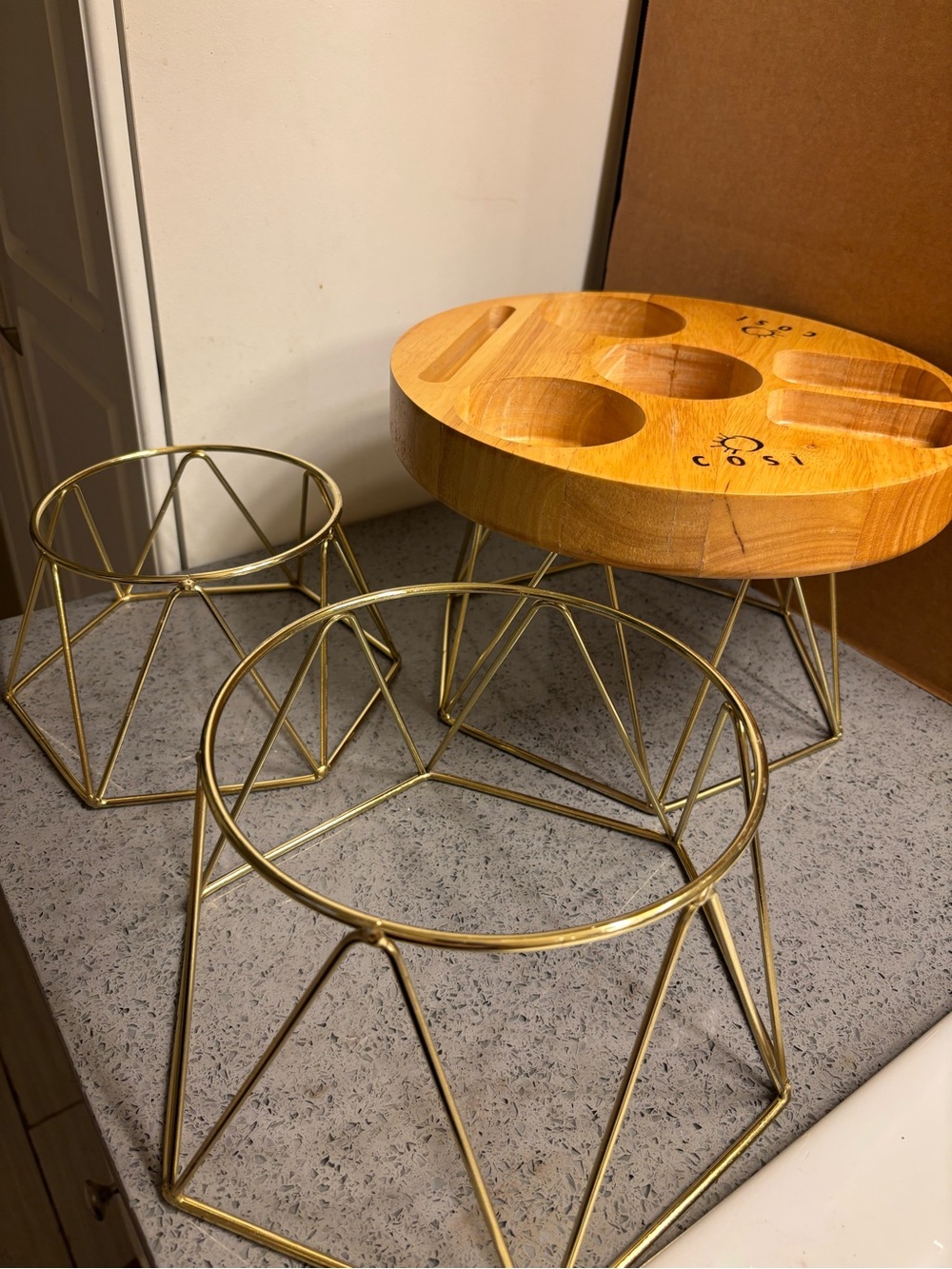 3 Gold Metal Riser Stands.
